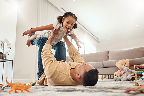 Family having fun sitting on floor in reading pennsylvania after eco-friendly home pest control services 